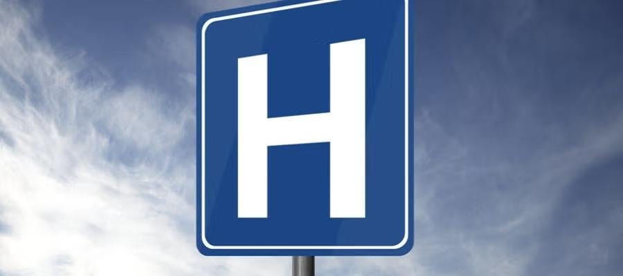 Hospital H sign. A while letter "H" on a blue background street sign.
